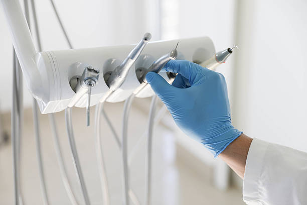 Professional Tooth Extraction technician working in Camden County County, NC